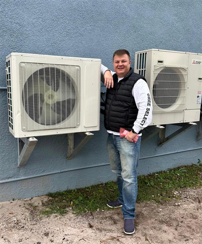 Prime HVAC Tech with outdoor units